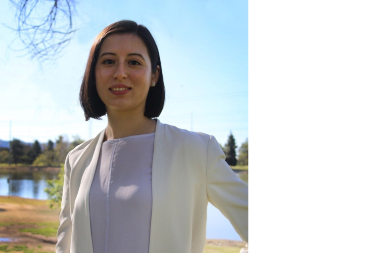 Portrait of Professor Alexandra Lossada in White Blazer